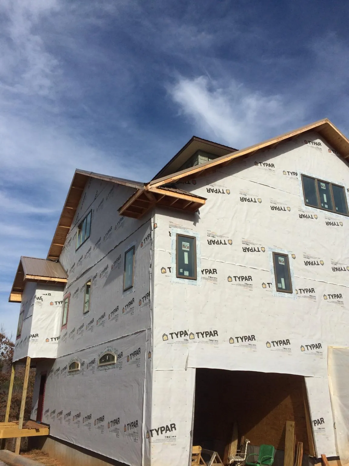 Stick built house wrapped in Typar with new roof framing and dormers in Troy